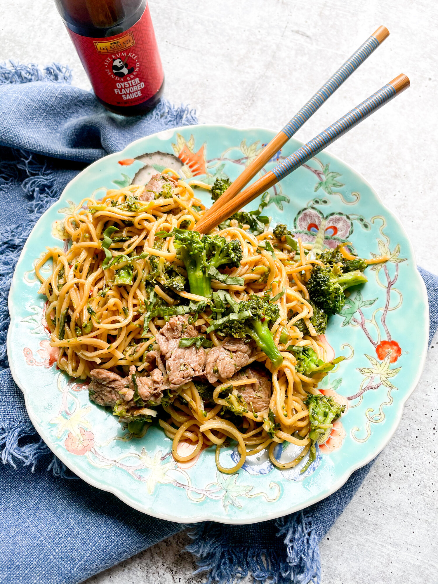 Stir fries are my go-to quick and easy meal. You just throw together some veggies, maybe some meat, either rice or noodles, and most importantly.. an insane sauce. I always have a full roster of [Lee Kum Kee](https://usa.lkk.com/) sauces, such as their [Panda Brand Oyster Sauce](https://usa.lkk.com/en/products/panda-brand-oyster-flavored-sauce), in my pantry, ready for action as a marinade, dip, or to help create a stir fry sauce. Oyster sauce adds an unexpected salty, sweet, bold flavor to this noodle dish that you just can’t get from anything else. Mix it up with a few other pantry staples, stir it in with some noodles and steak and you have an absolutely delicious, veggie and protein packed meal in under 20 minutes. Feel free to add more vegetables! Swap in thinly sliced chicken! Or shrimp! Use absolutely any skinny long noodle. Do your thing, make it work using what you already have in your pantry… but don’t skip the oyster sauce!
